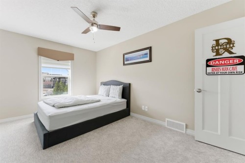 99 Marquis Cove Se, Calgary, AB - Indoor Photo Showing Bedroom
