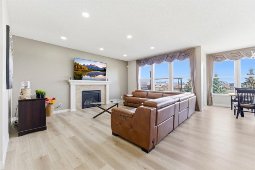 99 Marquis Cove Se, Calgary, AB - Indoor Photo Showing Living Room With Fireplace