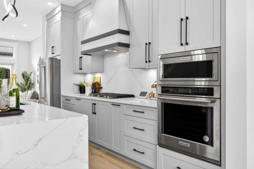 107 Hartford Road Nw, Calgary, AB - Indoor Photo Showing Kitchen With Stainless Steel Kitchen With Upgraded Kitchen