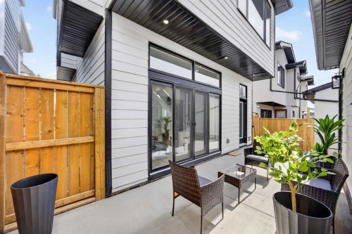 107 Hartford Road Nw, Calgary, AB - Outdoor With Deck Patio Veranda With Exterior