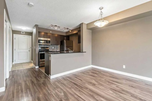 9410-403 Mackenzie Way Sw, Airdrie, AB - Indoor Photo Showing Kitchen