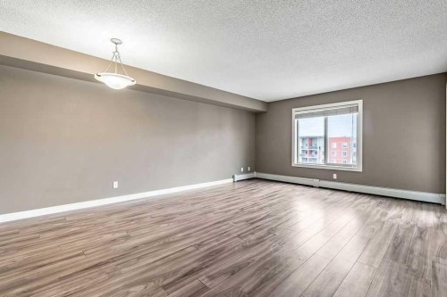 9410-403 Mackenzie Way Sw, Airdrie, AB - Indoor Photo Showing Other Room