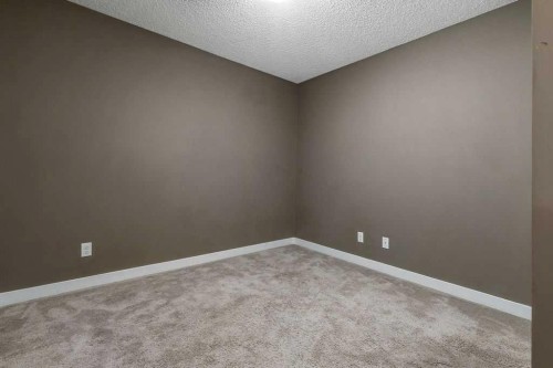 9410-403 Mackenzie Way Sw, Airdrie, AB - Indoor Photo Showing Other Room