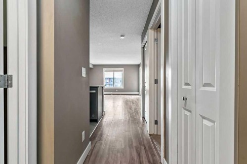 9410-403 Mackenzie Way Sw, Airdrie, AB - Indoor Photo Showing Other Room