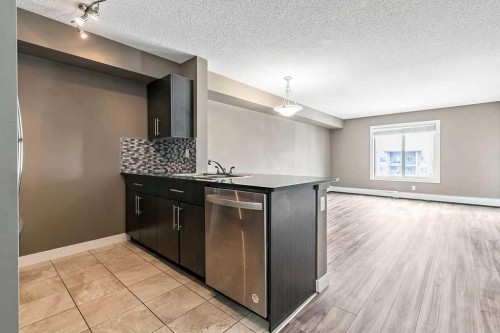 9410-403 Mackenzie Way Sw, Airdrie, AB - Indoor Photo Showing Kitchen