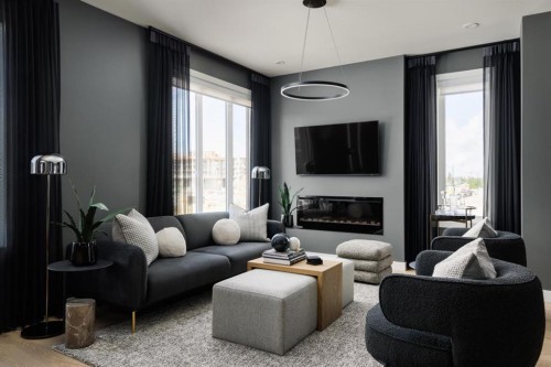 512-8155 8 Avenue Sw, Calgary, AB - Indoor Photo Showing Living Room With Fireplace