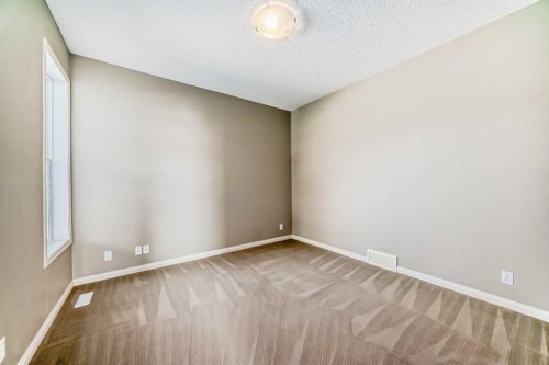 60 Sunset Circle, Cochrane, AB - Indoor Photo Showing Other Room