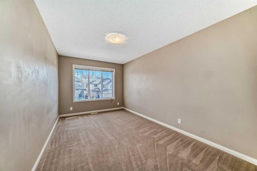 60 Sunset Circle, Cochrane, AB - Indoor Photo Showing Other Room