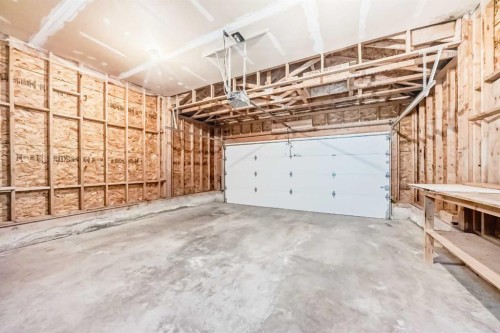 60 Sunset Circle, Cochrane, AB - Indoor Photo Showing Garage