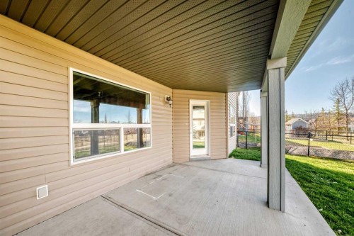 60 Sunset Circle, Cochrane, AB - Outdoor With Deck Patio Veranda With Exterior