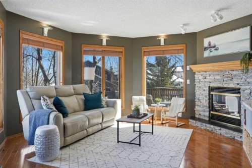 131 Edgebrook Circle Nw, Calgary, AB - Indoor Photo Showing Living Room With Fireplace