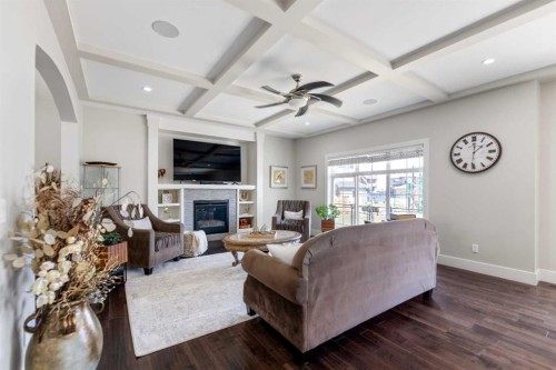 125 Kinniburgh Loop, Chestermere, AB - Indoor Photo Showing Living Room With Fireplace