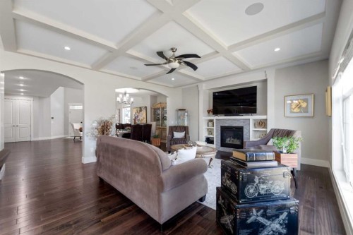 125 Kinniburgh Loop, Chestermere, AB - Indoor Photo Showing Living Room With Fireplace