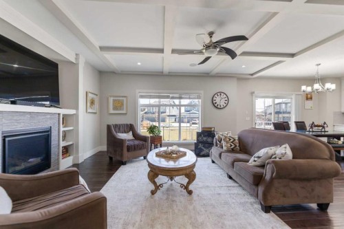 125 Kinniburgh Loop, Chestermere, AB - Indoor Photo Showing Living Room With Fireplace