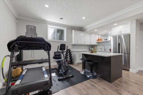 125 Kinniburgh Loop, Chestermere, AB - Indoor Photo Showing Gym Room