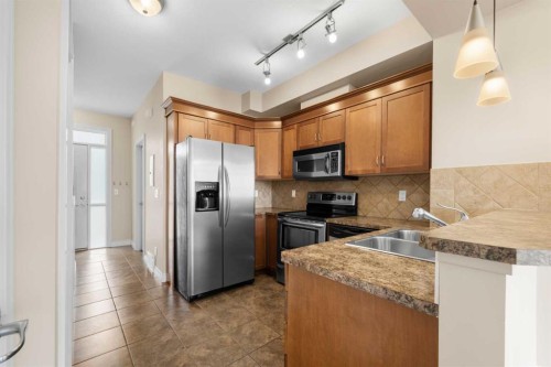 9-181 Rockyledge View Nw, Calgary, AB - Indoor Photo Showing Kitchen With Double Sink With Upgraded Kitchen