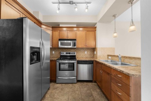 9-181 Rockyledge View Nw, Calgary, AB - Indoor Photo Showing Kitchen With Double Sink