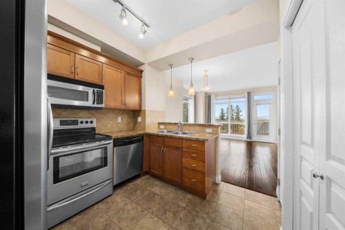 9-181 Rockyledge View Nw, Calgary, AB - Indoor Photo Showing Kitchen With Double Sink With Upgraded Kitchen