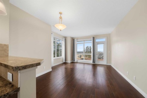 9-181 Rockyledge View Nw, Calgary, AB - Indoor Photo Showing Living Room