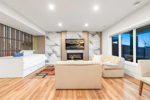 105 Carringvue Manor Nw, Calgary, AB - Indoor With Fireplace