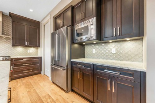 105 Carringvue Manor Nw, Calgary, AB - Indoor Photo Showing Kitchen With Upgraded Kitchen