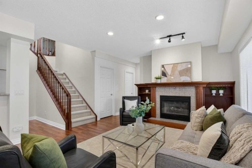 7051 Christie Briar Manor Sw, Calgary, AB - Indoor Photo Showing Living Room With Fireplace