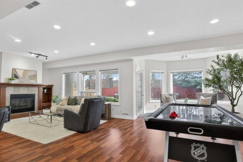 7051 Christie Briar Manor Sw, Calgary, AB - Indoor Photo Showing Other Room With Fireplace