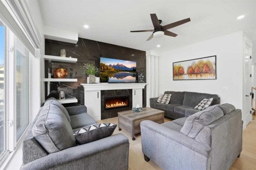 15 Saddlecrest Link Ne, Calgary, AB - Indoor Photo Showing Living Room With Fireplace