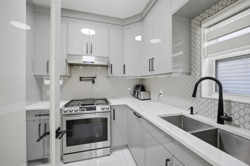 15 Saddlecrest Link Ne, Calgary, AB - Indoor Photo Showing Kitchen With Double Sink With Upgraded Kitchen