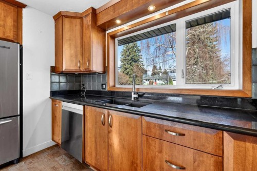 16 Heston Street Nw, Calgary, AB - Indoor Photo Showing Kitchen With Double Sink