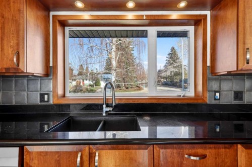 16 Heston Street Nw, Calgary, AB - Indoor Photo Showing Kitchen With Double Sink