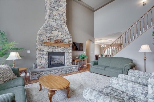 33550 Range Road 23, Rural Mountain View County, AB - Indoor Photo Showing Living Room With Fireplace