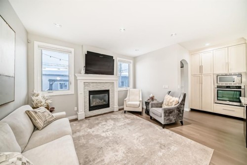 4627 83 Street Nw, Calgary, AB - Indoor Photo Showing Living Room With Fireplace