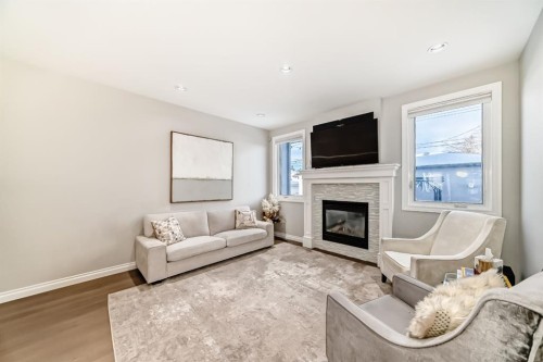 4627 83 Street Nw, Calgary, AB - Indoor Photo Showing Living Room With Fireplace