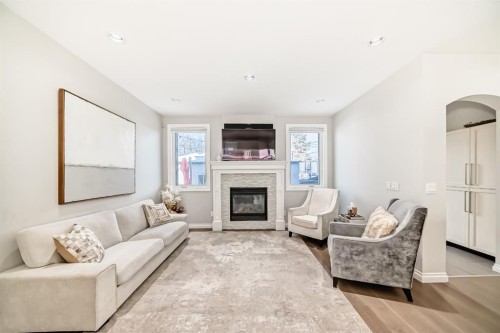 4627 83 Street Nw, Calgary, AB - Indoor Photo Showing Living Room With Fireplace