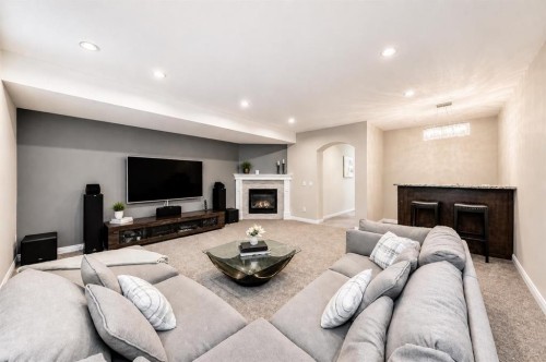 4627 83 Street Nw, Calgary, AB - Indoor Photo Showing Living Room With Fireplace