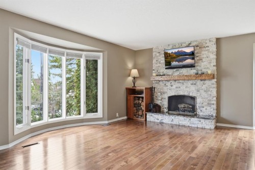 330 Silver Ridge Crescent Nw, Calgary, AB - Indoor Photo Showing Living Room With Fireplace