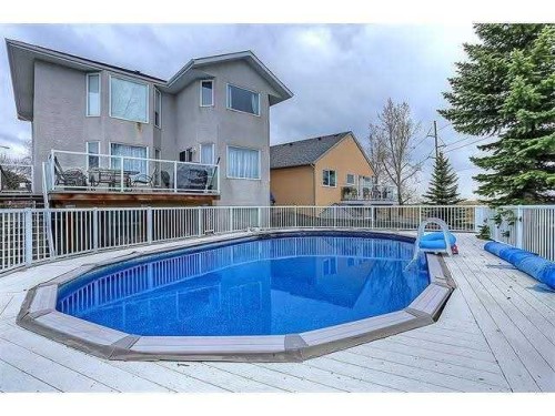 230 Sierra Nevada Place Sw, Calgary, AB - Outdoor With Above Ground Pool With Deck Patio Veranda With Exterior