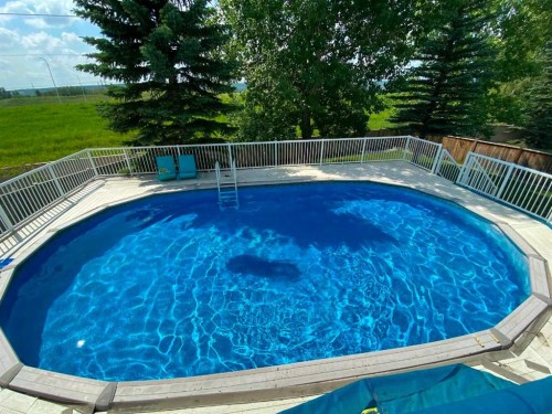 230 Sierra Nevada Place Sw, Calgary, AB - Outdoor With Above Ground Pool With Backyard