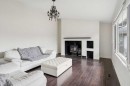 214 Springwood Place Sw, Calgary, AB  - Indoor Photo Showing Living Room With Fireplace 