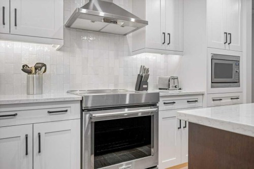 205A-1012 Spring Creek Drive, Canmore, AB - Indoor Photo Showing Kitchen With Upgraded Kitchen