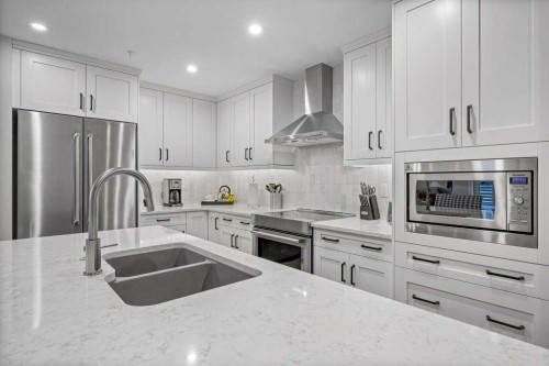 205A-1012 Spring Creek Drive, Canmore, AB - Indoor Photo Showing Kitchen With Double Sink With Upgraded Kitchen