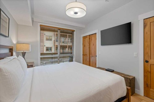 205A-1012 Spring Creek Drive, Canmore, AB - Indoor Photo Showing Bedroom