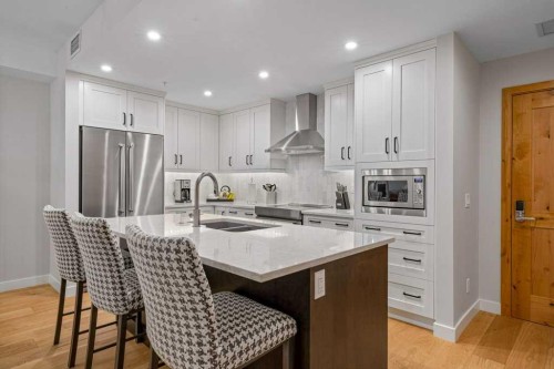 205A-1012 Spring Creek Drive, Canmore, AB - Indoor Photo Showing Kitchen With Double Sink With Upgraded Kitchen