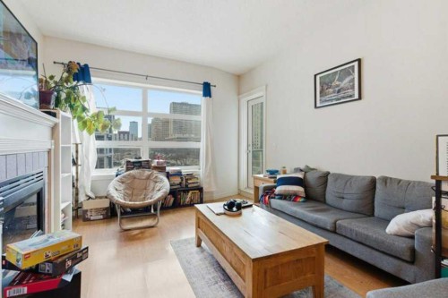317-333 Riverfront Avenue Se, Calgary, AB - Indoor Photo Showing Living Room With Fireplace