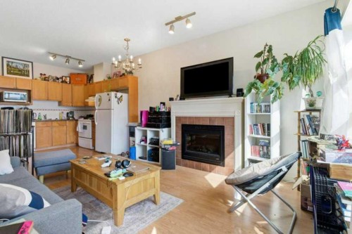 317-333 Riverfront Avenue Se, Calgary, AB - Indoor Photo Showing Living Room With Fireplace
