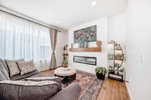 32 Sugarsnap Way Se, Calgary, AB - Indoor Photo Showing Living Room With Fireplace