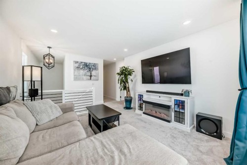 32 Sugarsnap Way Se, Calgary, AB - Indoor Photo Showing Living Room