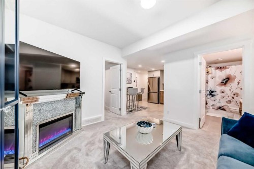 32 Sugarsnap Way Se, Calgary, AB - Indoor Photo Showing Living Room With Fireplace