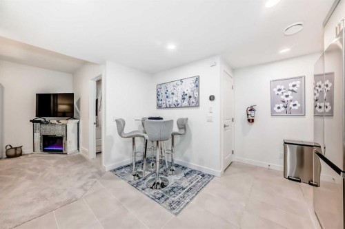 32 Sugarsnap Way Se, Calgary, AB - Indoor With Fireplace